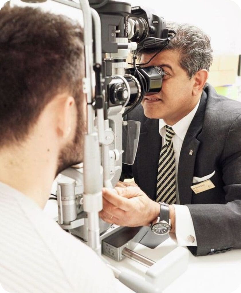 Sheraz Daya inspecting a patients eye at Centre for Sight