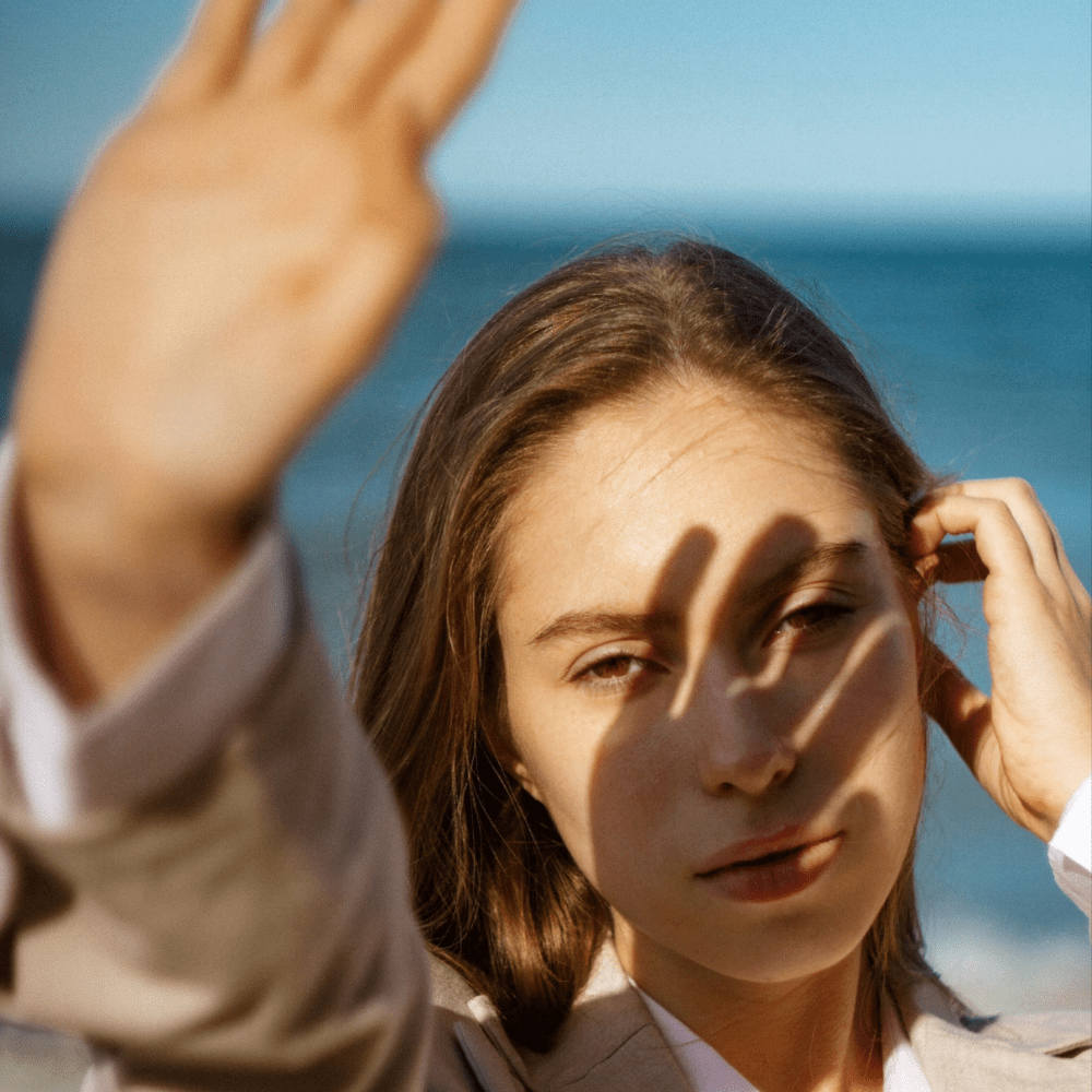 Centre for Sight image of Woman with sheilding eyes from sun