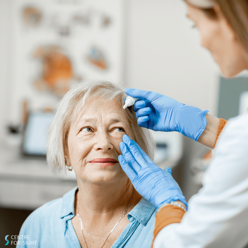 Women being administered eye drops