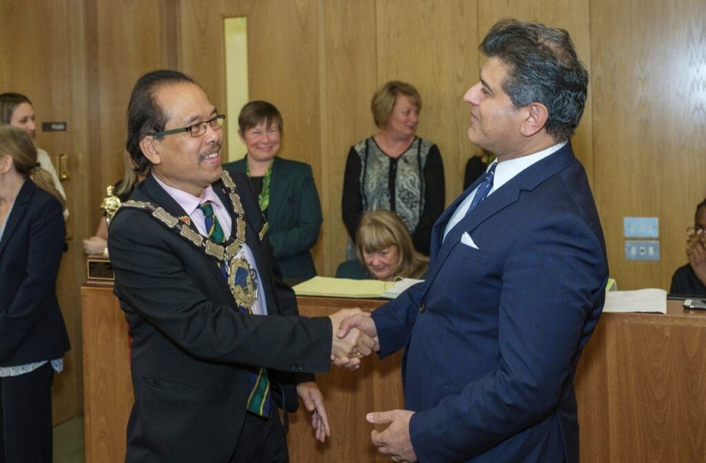 Image of Medical Director Sheraz Daya and Cllr Danny Favor at Centre for Sight receiving the winning design award