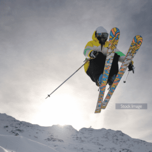 Man skiing doing extreme sports wearing brightly coloured ski gear